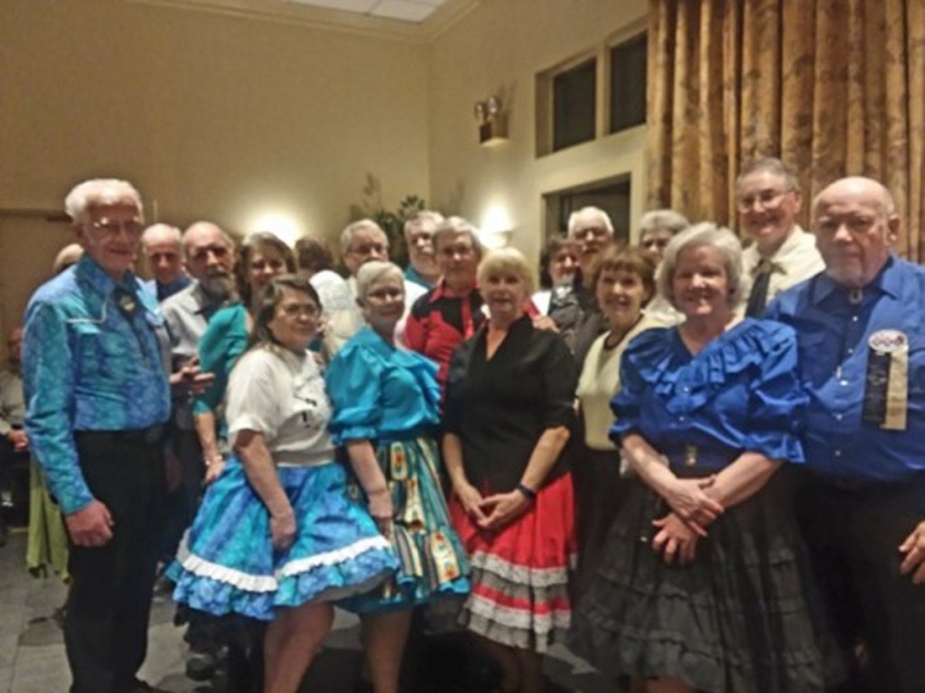 Area square dancers recently spent a weekend advanced level square dancing. In front, from left, are Ellie Saunders, Ellie Mulcahy, Nanci Temple, Margaret Carter and Cindy Fairfield. In the middle, from left, are Steve Saunders, Milton and Charlotte Sinclair, Dave Mulcahy, Fred Temple, Wes and Sue Burgess, Bruce Carter and Bob Brown. In back, from left, are Betty and Steve Harris, Larry and Kathleen Hillman.