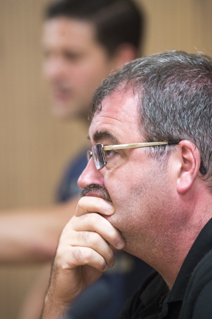 Councilor Sydney Mayhew, R-Ward 4, listens to Tom Ferris challenge his remarks during a special council budget meeting Tuesday in the City Council chamber at The Center in Waterville.