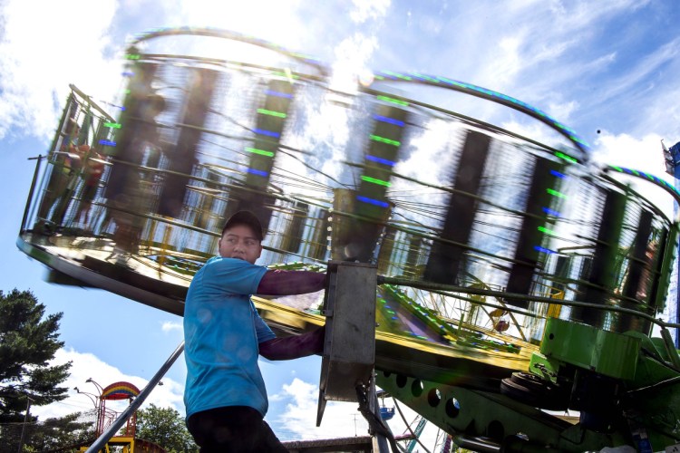 Juan Garcia operates the Gravitron on Thursday at the 200th annual Skowhegan State Fair.