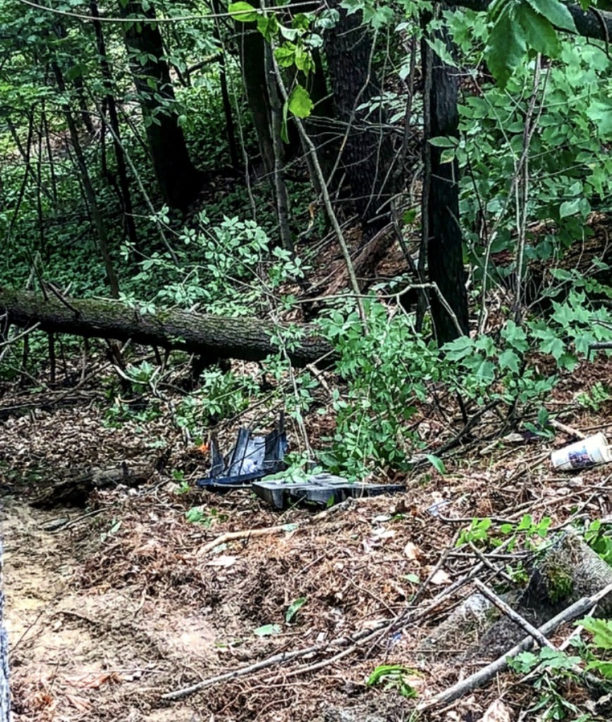 Debris from a Chevrolet Impala remains scattered Sunday afternoon on a sloped hill off the side of Augusta Road in Winslow, where a fatal crash had taken place early that morning. Gabe Stuart, 52, of Waterville, was pronounced dead at the scene by medical personnel. Police have yet to determine the accident's cause.