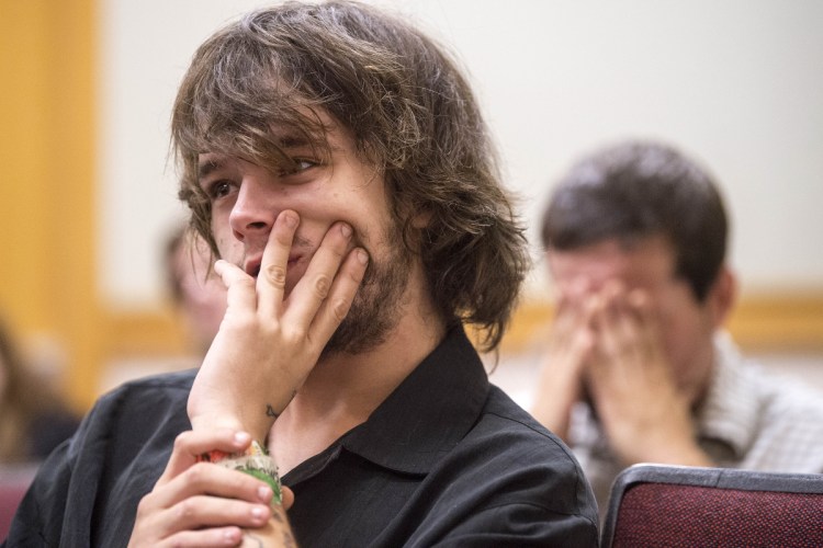 Paul Goodridge, back right, sits in court with his son Noah Goodridge, who waits to enter a not guilty plea Wednesday in Skowhegan District Court to a charge of assault in connection with a June 12 incident involving a Skowhegan police officer. Goodridge says he had a seizure and the police officer, who arrested him, misunderstood what was happening.