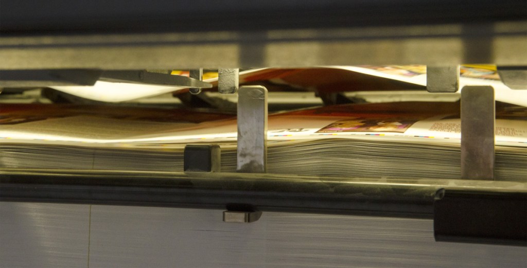 Sheets come off the new Heidelberg press on Friday at J.S. McCarthy in Augusta.