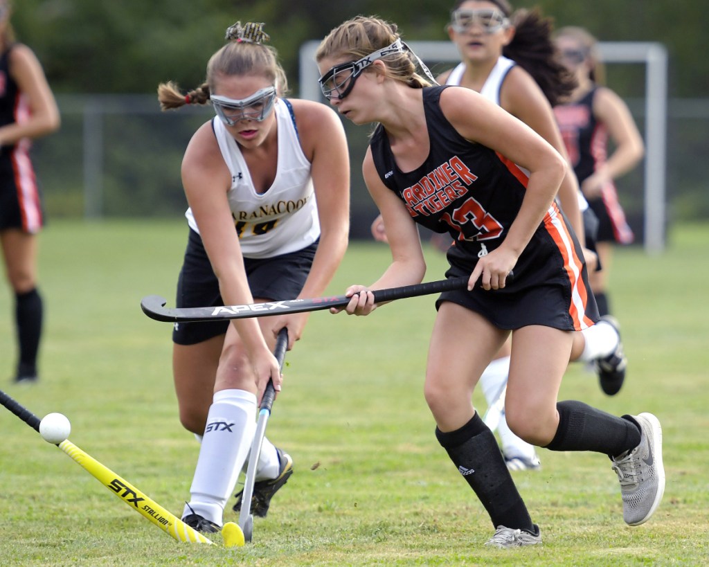 Maranacook's Haylee Weeks, left, tries to break up a pass to Gardiner's Olivia Tyler during a game Thursday in Readfield.