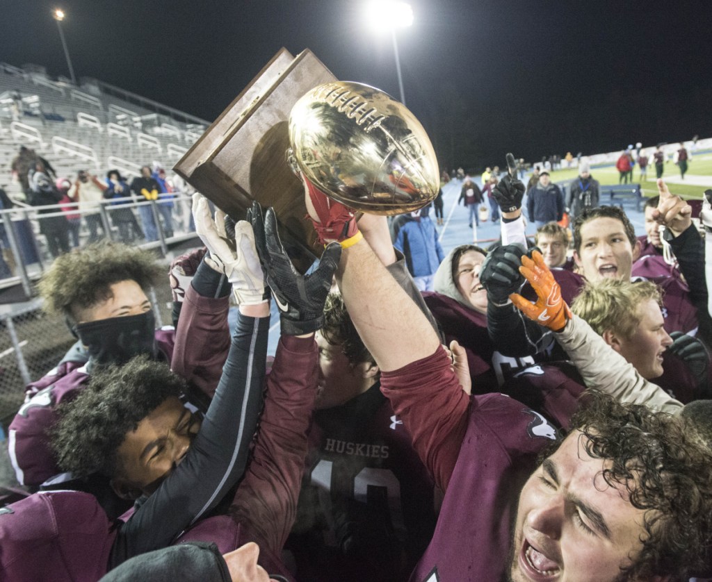 Staff file photo by Michael G. Seamans 
 The Maine Central Institute football team celebrates its 30-13 win over Cape Elizabeth in the Class C state championship game last year at the University of Maine in Orono. The Huskies have the talent to contend again, but they won't sneak up on anyone this season.