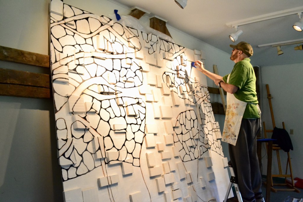 Clif Travers working in his studio.