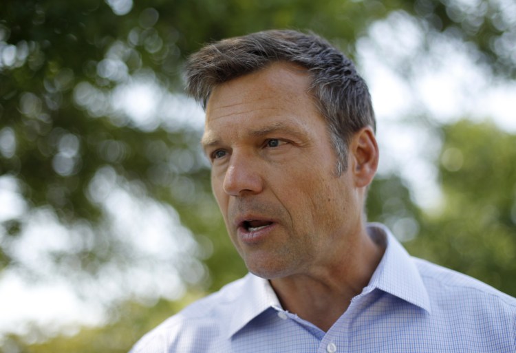 Kris Kobach, Kansas secretary of state and candidate for the Republican nomination for Kansas governor,  addresses supporters in early August.