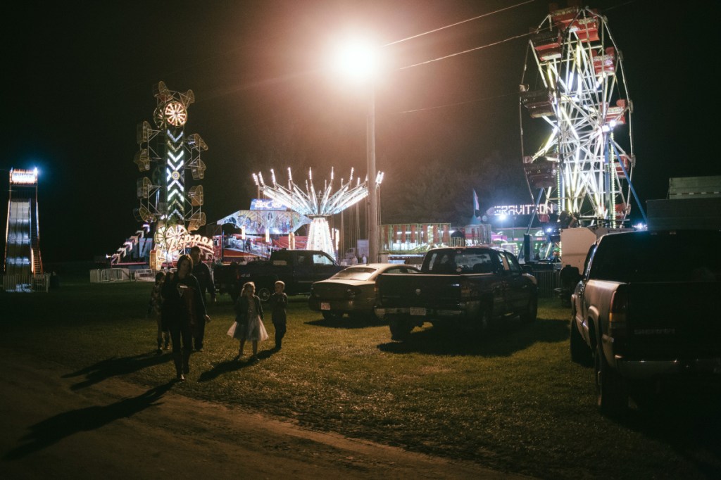 File photo 
 A family leaves the Clinton Lions Agricultural Fair after the Maine Dairy Princess Scholarship pageant last year.