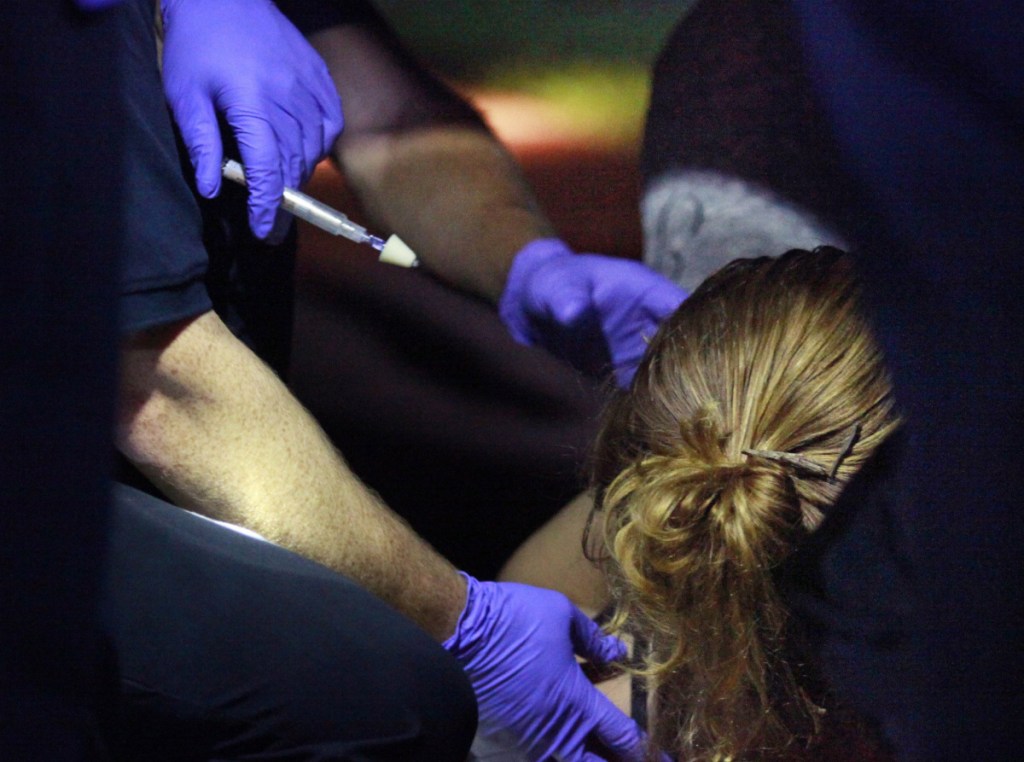 Portland paramedics respond to a call of a heroin overdose on Congress Street near the intersection of India Street in 2015. The 29 year-old woman regains consciousness after being administered 1mg of Narcan to combat the effects of the heroin. She later said that she usually shoots up twice daily with   gram doses, but had only used   gram because she had heard that it was strong heroin.