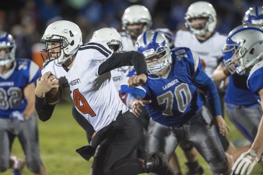 Skowhegan quarterback Marcus Christopher (4) rushes for a touchdown against Lawrence on Friday in Fairfield.