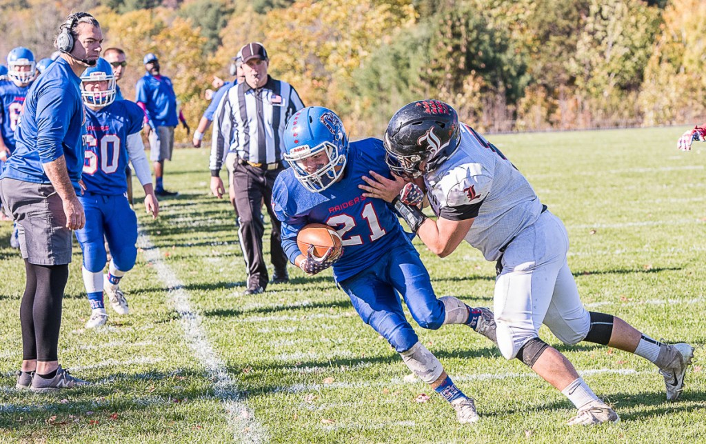 Oak Hill's Caleb Treadwell (21) is foreced out of bounds by Lisbon's Lucas Francis during Saturday's game in Wales.