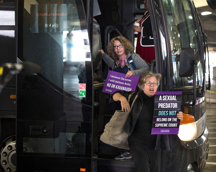 Susan Feiner, front, gets off a bus at Union Station in Washington, D.C., with a group of Mainers on Oct. 4. The group traveled from Maine overnight in hopes of meeting with Sen. Susan Collins to voice their opposition to then-Supreme Court nominee Brett Kavanaugh. Feiner, a retired USM professor, has been barred from teaching because she offered students a “pop-up” course for credit to take the bus to D.C. with demonstrators. 