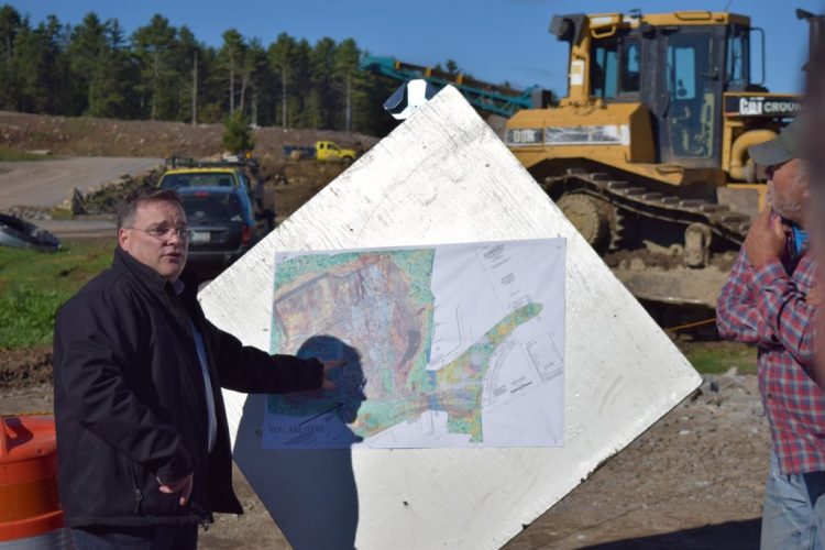 Architect Ron Lamarre of Lavallee Brensinger explains the plans for the new high school to visitors Wednesday.