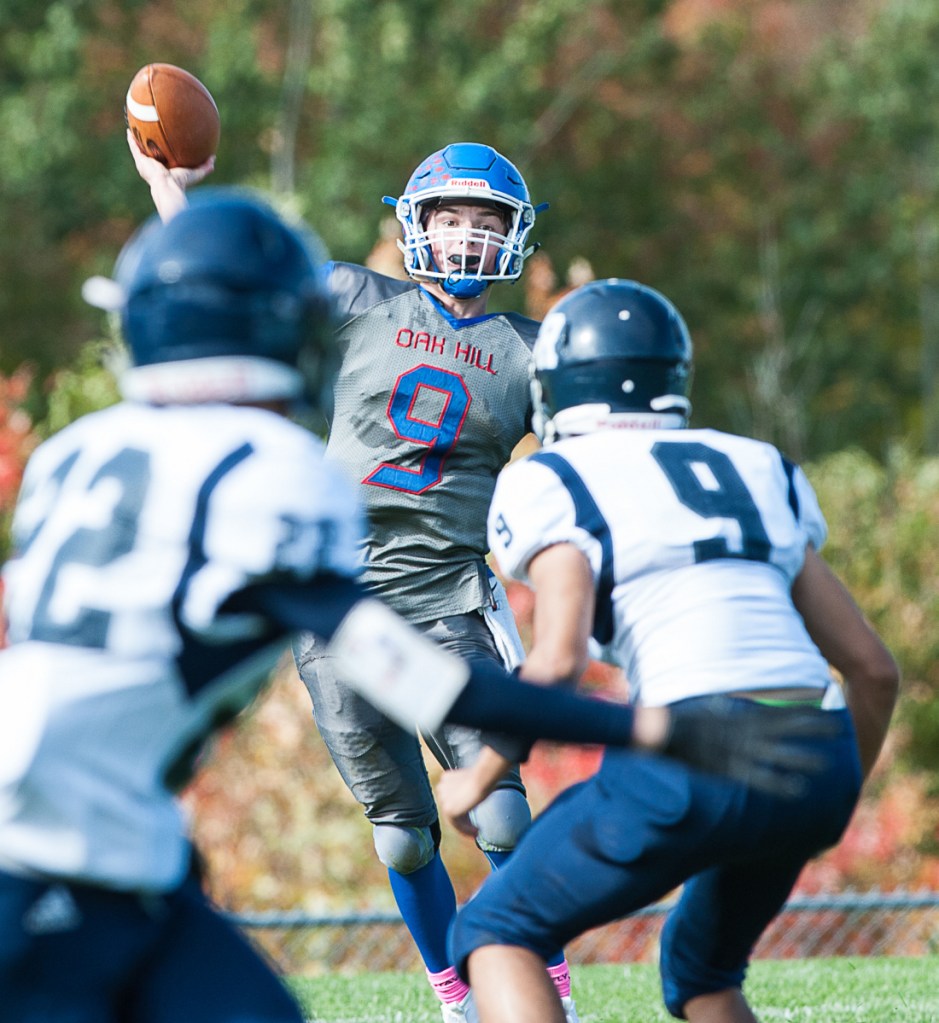 Oak Hill quarterback Gavin Rawstron fires a pass over the head of Poland defenders for a long completion during a game earlier this season.