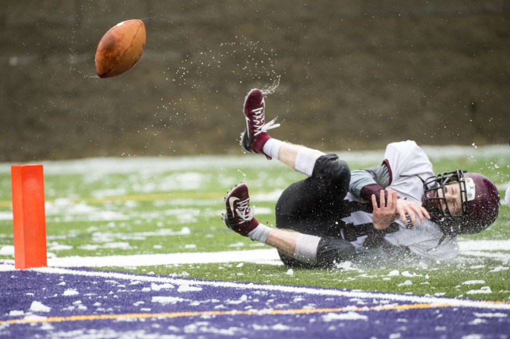 Staff photo by Michael G. Seamans 
 Nokomis' Tyler Pelletier can't hold onto a pass near the end zone against Hermon in the Class C North championship game Saturday at Hampden Academy.