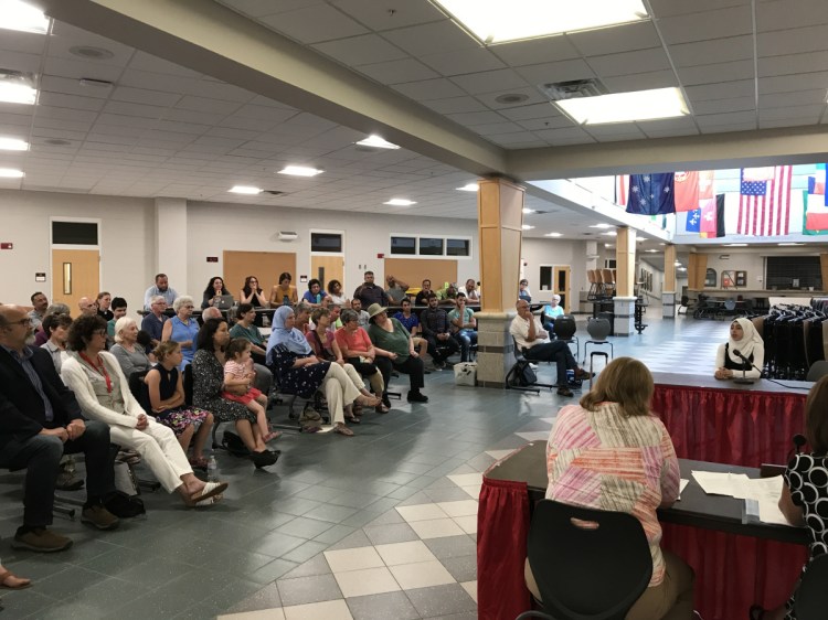 Fatima Halawa, a student at Cony High School whose family has moved to Maine from Syria, speaks about the holidays of the Muslim faith during the Aug. 6 meeting of the Augusta Board of Education's policy committee.