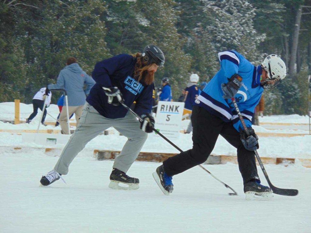 Jared "Jedi" Baker of Maine Cabin Masters, left, and Travis Ridky, of Camden National Bank compete in the 2018 tournament Feb. 9-11 in Sidney.