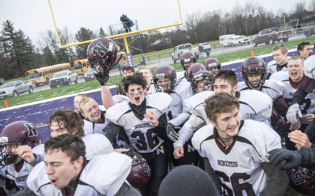 Nokomis celebrates its 13-6 win over Hermon in the Class C North championship game last Saturday at Hampden Academy.