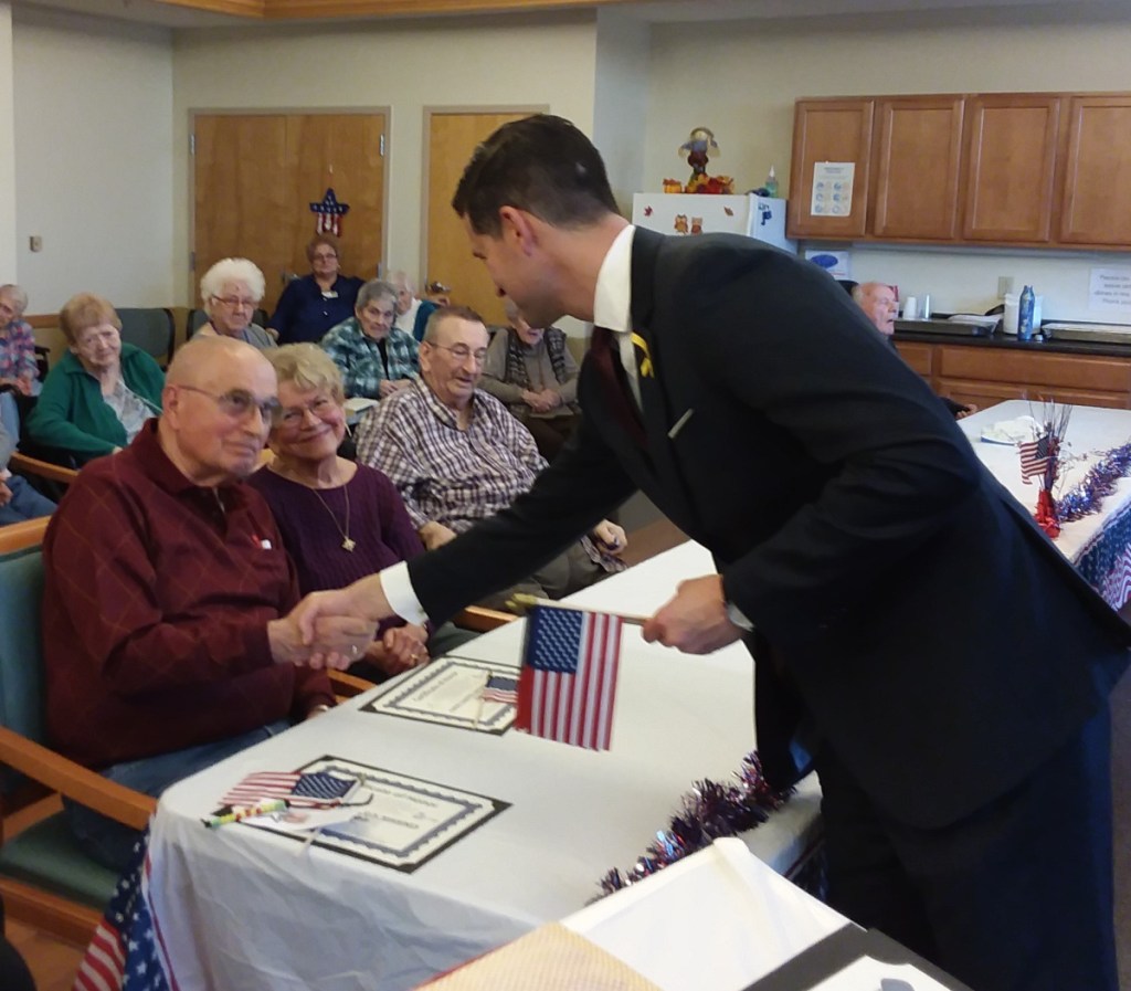 Mayor Nick Isgro with veteran Wayne Chaffee and his wife Shirley.