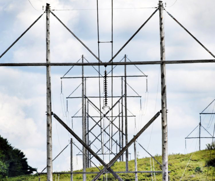 These 345-volt transmission lines cross Route 201 in Topsham July 30, 2008. Central Maine Power is proposing to build a 145-mile transmission line that will carry power from Quebec to Massachusetts through Somerset, Franklin and Androscoggin counties, but opposition to the project is mounting.