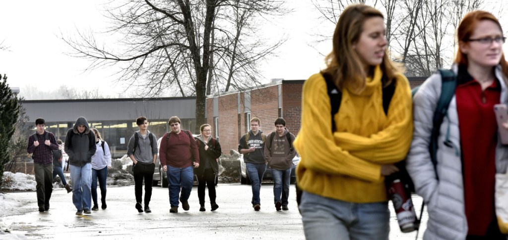 Students leave Skowhegan Area High School at the end of the day on Monday. Police presence was added following a threat to the school posted on social media.