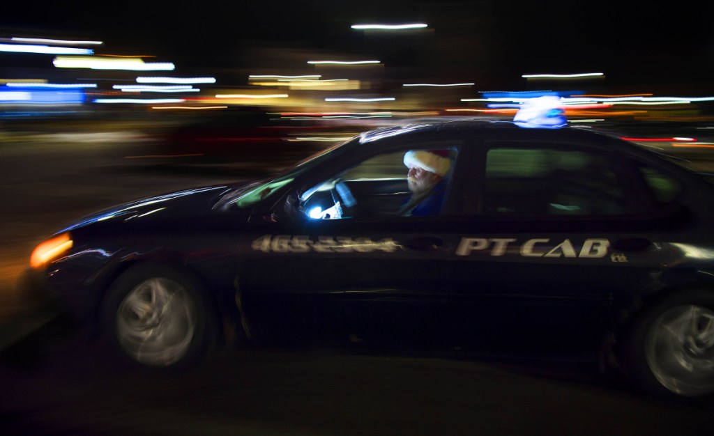 Mike Paradis, a driver for PT Cab, drives through the Concourse on Thursday. The eight cab companies that operate out of Fairfield, Oakland and Waterville have 31 cabs and 48 drivers.