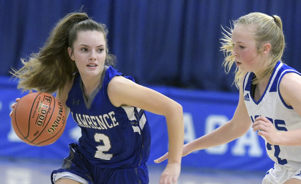 Erskine's Mackenzie Roderick, right, guards Lawrence's Megan Curtis during a Kennebec Valley Athletic Conference game Friday  in South China.