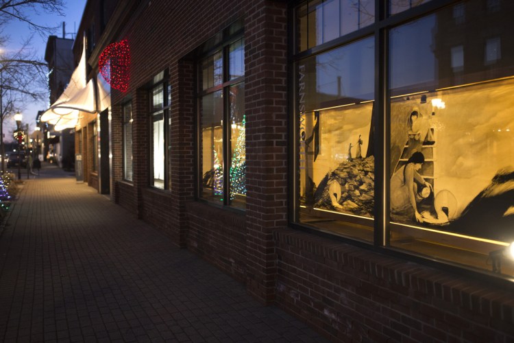 A "crankie," a painted scroll that tells a narrative story with images as it unwinds, made by artist Annie Bailey in a window display at the Farnsworth Museum in Rockland on Friday, December 7, 2018. The moving panorama tells the story of 16-year-old Abbie Burgess, who in 1856, kept Matinicus Rock's two lights burning through a ferocious storm while simultaneously caring for her mother and younger siblings.