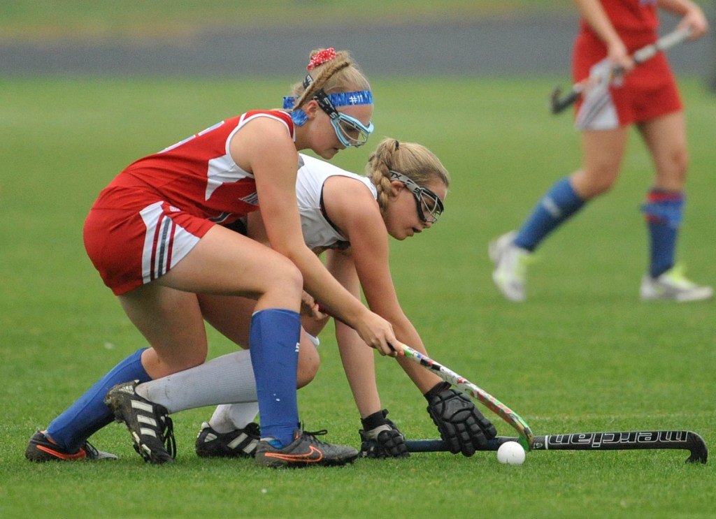 Staff photo by Michael G. Seamans 
 Messalonske's Autumn Littlefield, left, battles for the ball with Skowhegan's Elizabeth York during a Class A North game last season in Skowhegan. Both players are on the Majestix U19 team that has reached the national tournament.