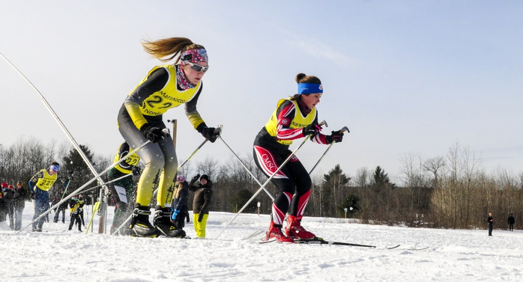 Maranacook's Maura Taylor, left, and Central Maine Academy's Emma Digiralomo race during the Maranacook Waves on Saturday at Quarry Road Trails in Waterville.