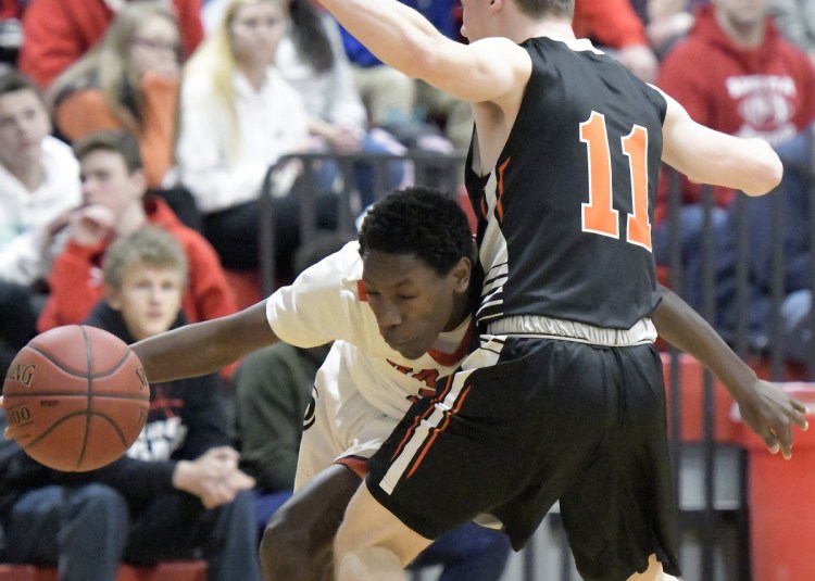 Cony's Simon McCormick collides with Gardiner's Casey Gallagher (11) during a Kennebec Valley Athletic Conference Class A game Tuesday in Augusta.