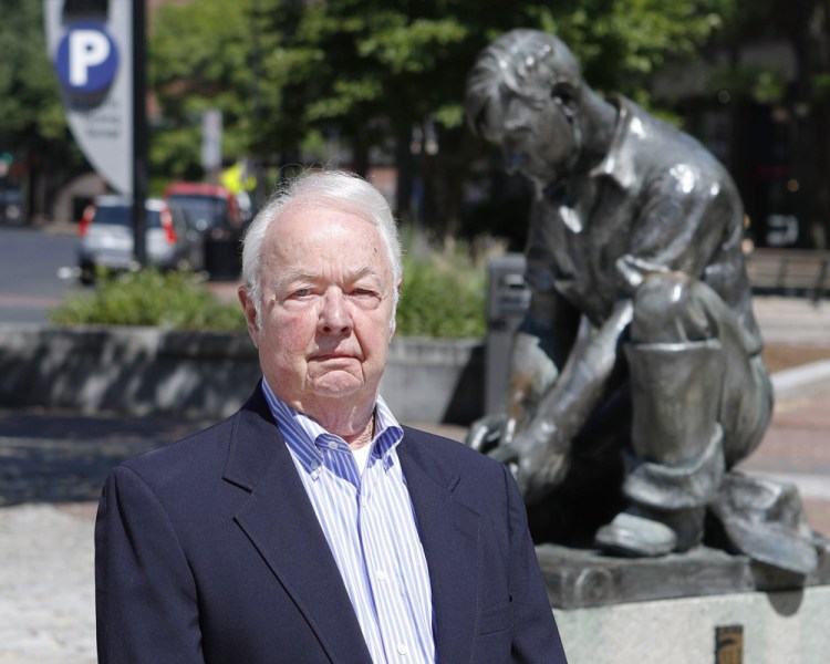 Former Portland City Manager John Menario poses for a photo in 2016, when the plaza next to the Temple Street parking garage was renamed John Menario Plaza. He died Thursday at 83.