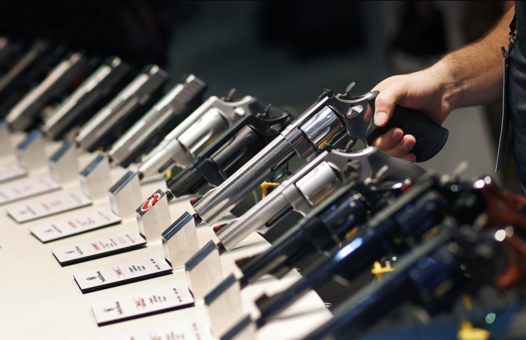 Handguns are displayed at the Smith and Wesson booth at the Shooting, Hunting and Outdoor Trade Show in Las Vegas in 2016. 