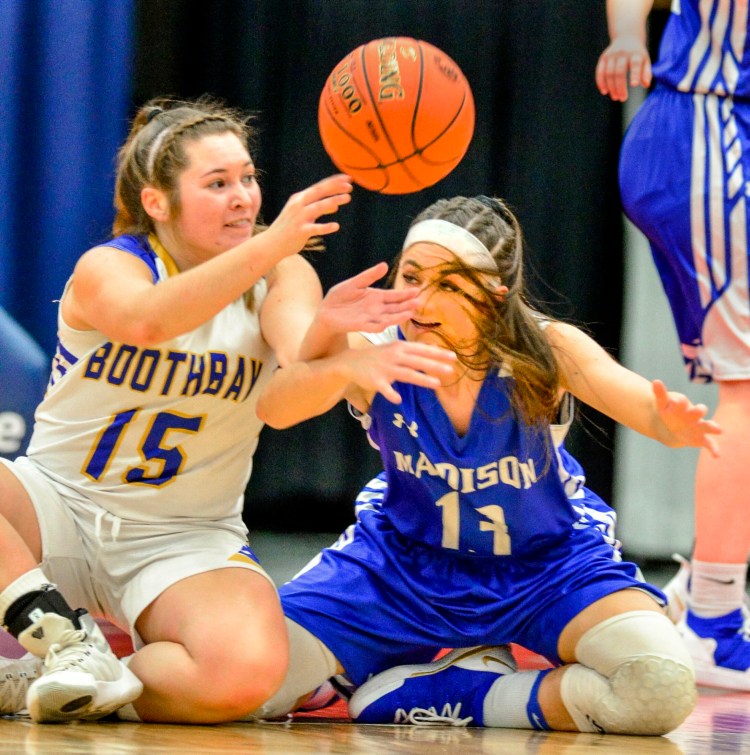 Boothbay's Madison Faulkingham, left, and Madison's Emily Edgerly go after a loose ball during a Class C South semifinal game last season at the Augusta Civic Center.