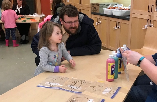 Guy Meader and his daughter Addie attend Literacy for ME's Augusta team-sponsored annual Pre-School Family Fun Night at Lithgow Public Library in Augusta. 
