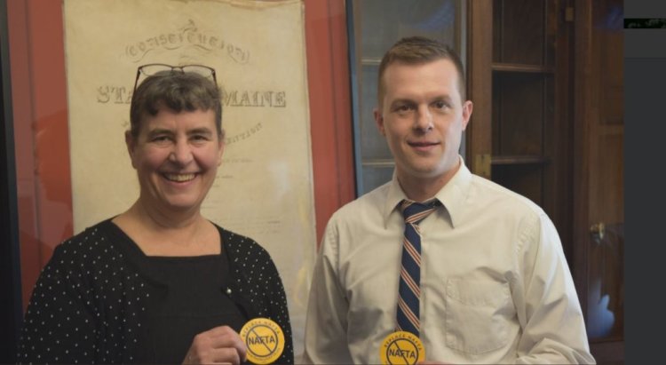 U.S. Rep. Jared Golden, a 2nd District Democrat, posing with Cynthia Phinney, leader of the Maine AFL-CIO, whom he invited to this week's State of the Union speech. They are each holding buttons opposing the North American Free Trade Agreement.
