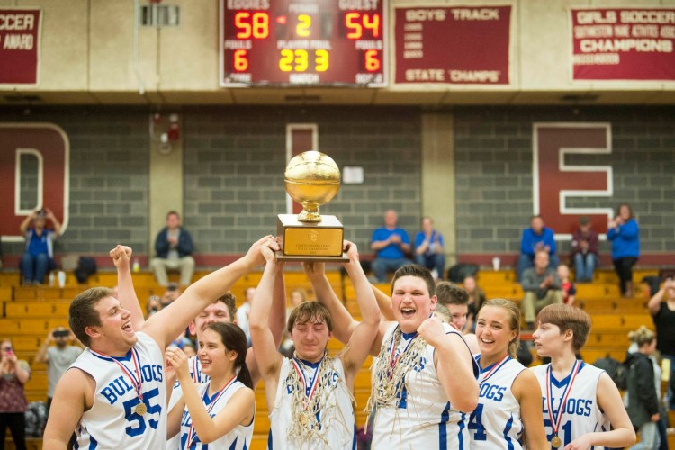 Madison Area Memorial High School's Scott Sawtelle hoists the gold ball with his teammates after the Unified Championship game on March 19. The spokeswoman for Special Olympics Maine said, "Unified Champion schools are growing like crazy here in the state of Maine and changing cultures in the entire school community." U.S. Secretary of Education Betsy DeVos proposes cutting federal funding for Special Olympics.