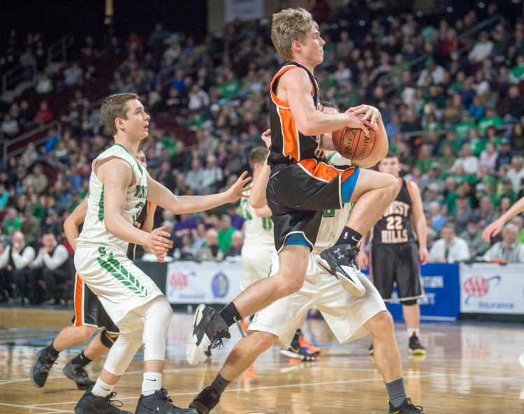 Forest Hills' Dalton Gregoire draws the foul from Schenk's Travis Thompson in the Class D state championship game Saturday at the Cross Insurance Center in Bangor.