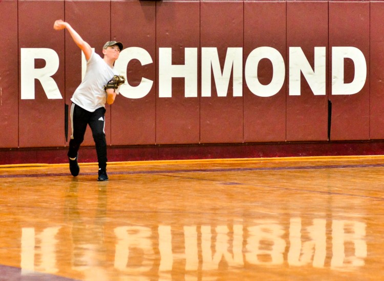 Cole Alexander throws long toss on Wednesday at Richmond High School. 