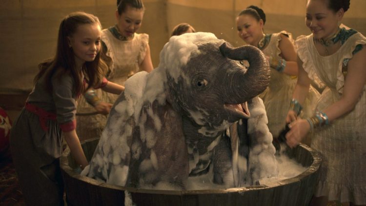 Nico Parker, left, in a scene from "Dumbo." 