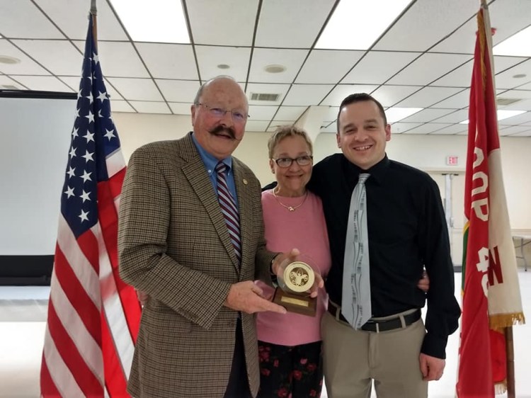 John Fortier, left, with his wife Lisa and son Alek.