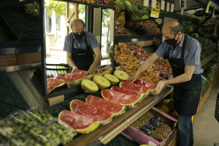 A worker arranges at a market in Ankara, Turkey. 
Russia’s invasion of Ukraine has severely disrupted global trade, battering a global economy that had been recovering robustly from the pandemic. Already-high commodity prices have gone even higher as a result.